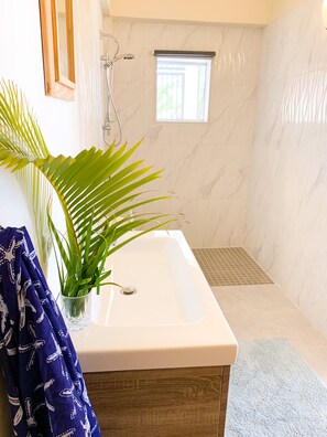 Bathtub, hair dryer, towels, soap