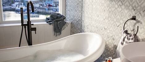 Bathtub, hair dryer, towels