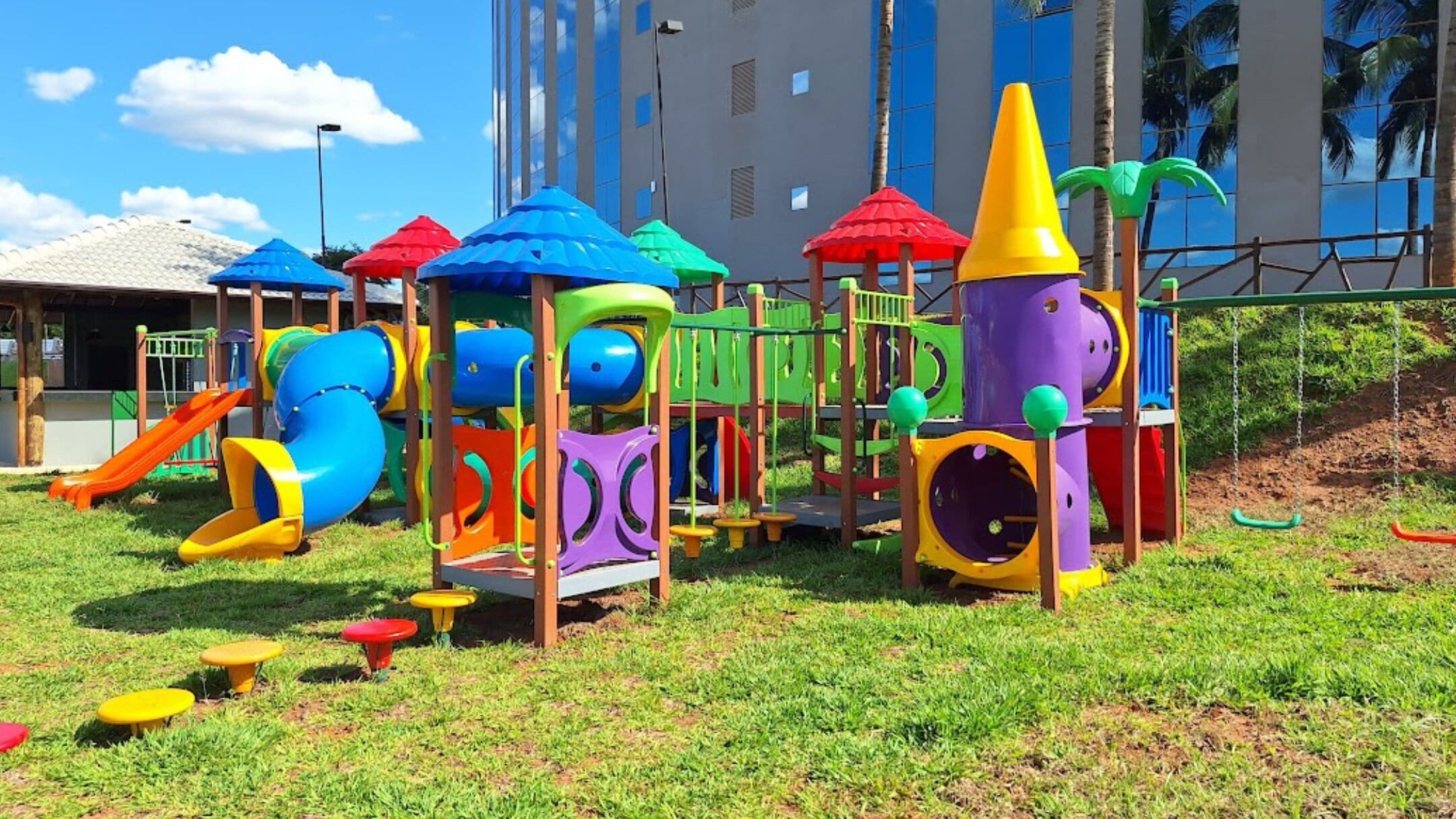 A playground with slides and climbing structures.