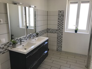 Shower, hair dryer, towels, toilet paper