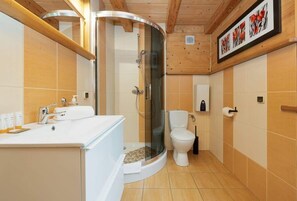Shower, hair dryer, towels, shampoo