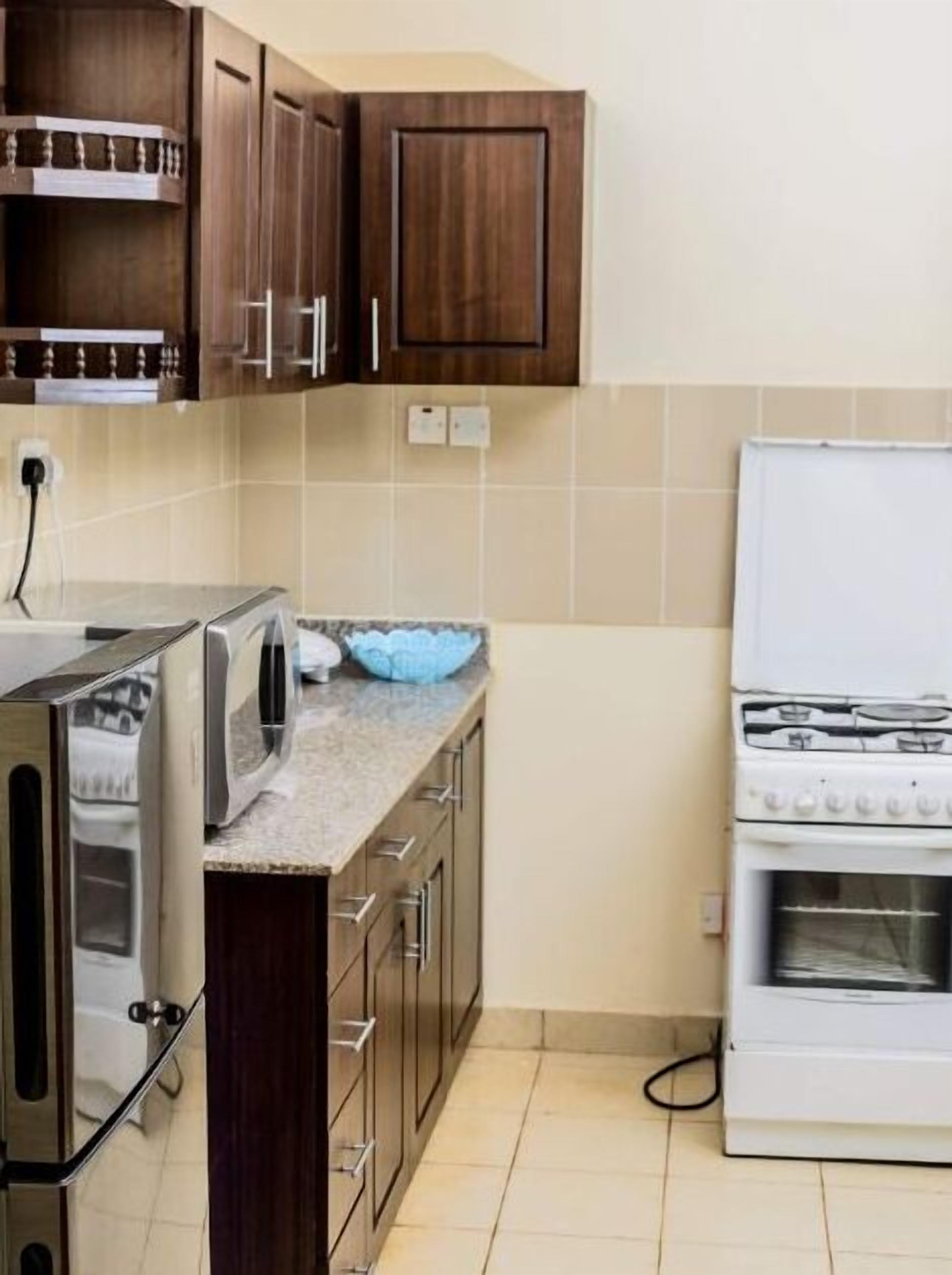 Fridge, microwave, cookware/dishes/utensils