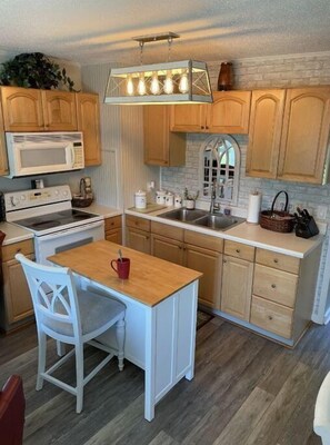 Microwave, coffee/tea maker, cookware/dishes/utensils