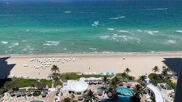 On the beach, sun loungers, beach towels