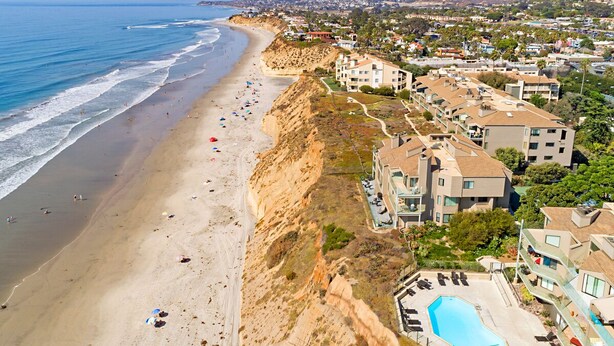 A coastal hotel with a swimming pool, beachfront view, and multiple buildings. - High End Oceanfront Home, a 2 min walk to Beach, Shops, Dining & More in Solana (Solana Beach)