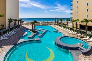 A swimming pool with a view of the beach and ocean.