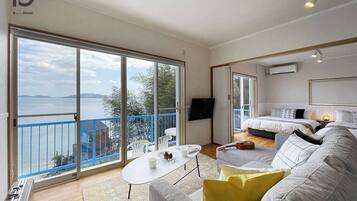 Superior-Haus, 1 Schlafzimmer, Nichtraucher, Meerblick | Wohnbereich | Flachbildfernseher