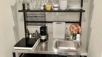 Coffee/tea maker, fridge, microwave, cookware/dishes/utensils
