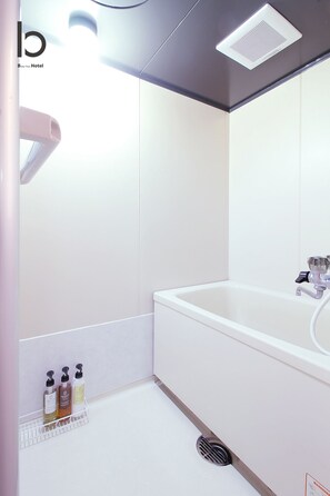 Apartment, 2 Bedrooms, Non Smoking (405) | Bathroom | Separate tub and shower, free toiletries, hair dryer, slippers