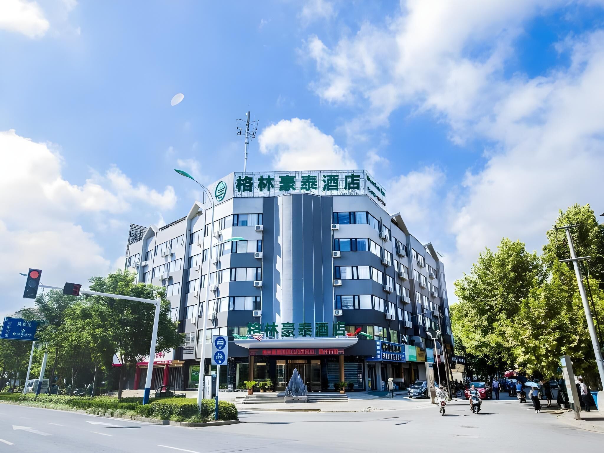 A multi-story hotel with a prominent sign at the top.