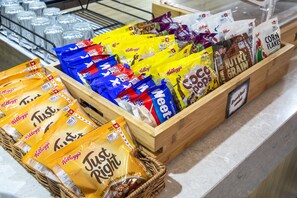 A display of various snack products including Kellogg's Just Right and Corn Flakes. - Nightelier Carrum Downs Sands Hotel (Carrum Downs)