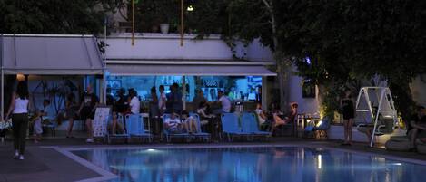 Seasonal outdoor pool, open 9:30 AM to 7:00 PM, pool umbrellas