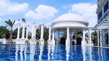 Outdoor pool, open 8:00 AM to 9:00 PM, pool loungers, lifeguards on site