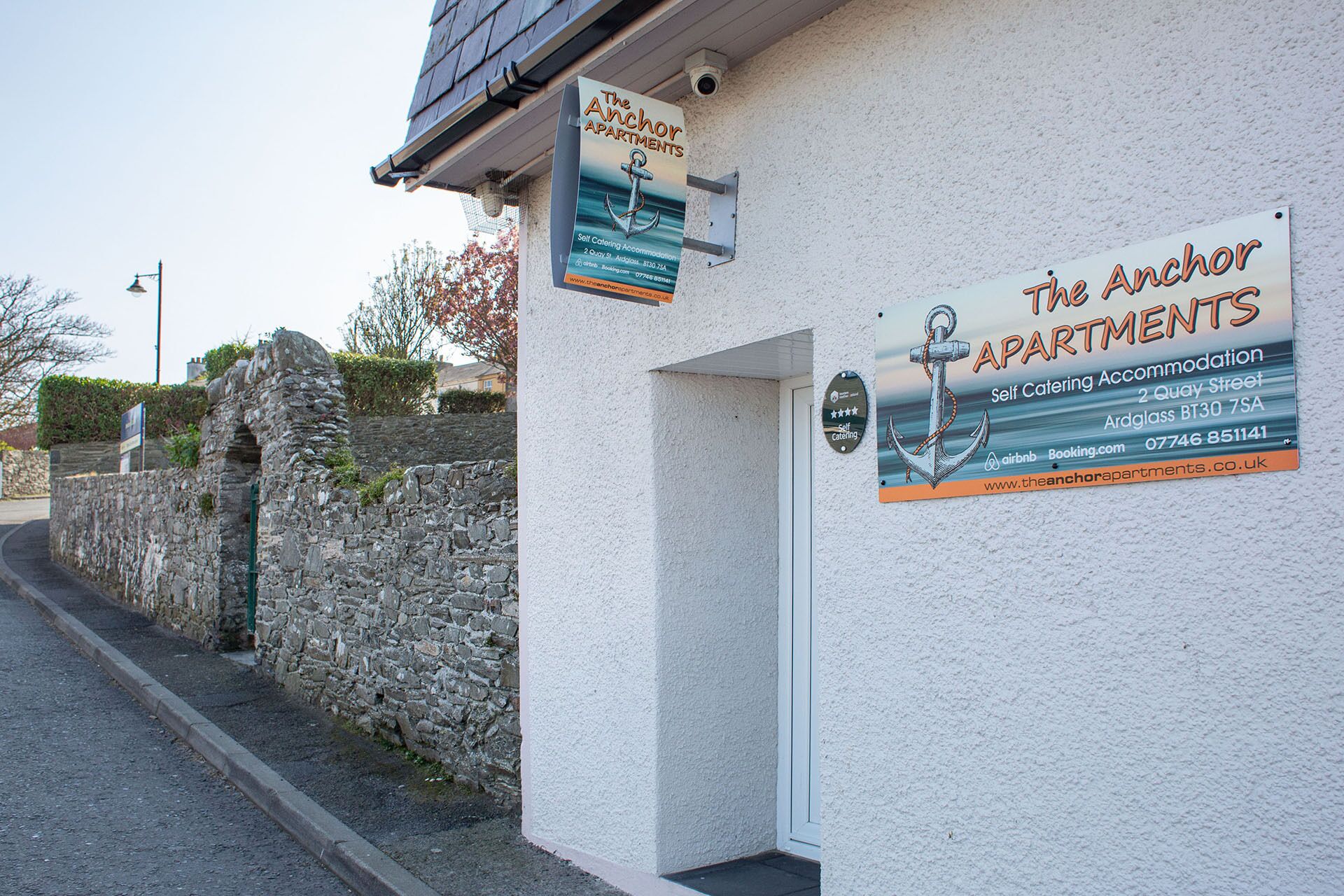 A building with a sign advertising 'The Anchor Apartments' as self-catering accommodation.