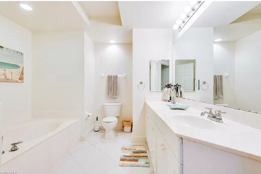 Bathtub, hair dryer, towels, soap