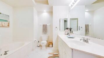 Bathtub, hair dryer, towels, soap