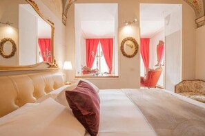 Italiaanse Frette-lakens, luxe beddengoed, donzen dekbedden, een minibar