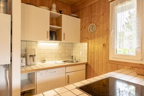 Fridge, stovetop, dishwasher, coffee/tea maker