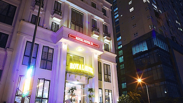 A hotel with a prominent sign reading "ROYAL HOTEL" and a staircase leading to the entrance. - Royal Hotel II (Hanoi)