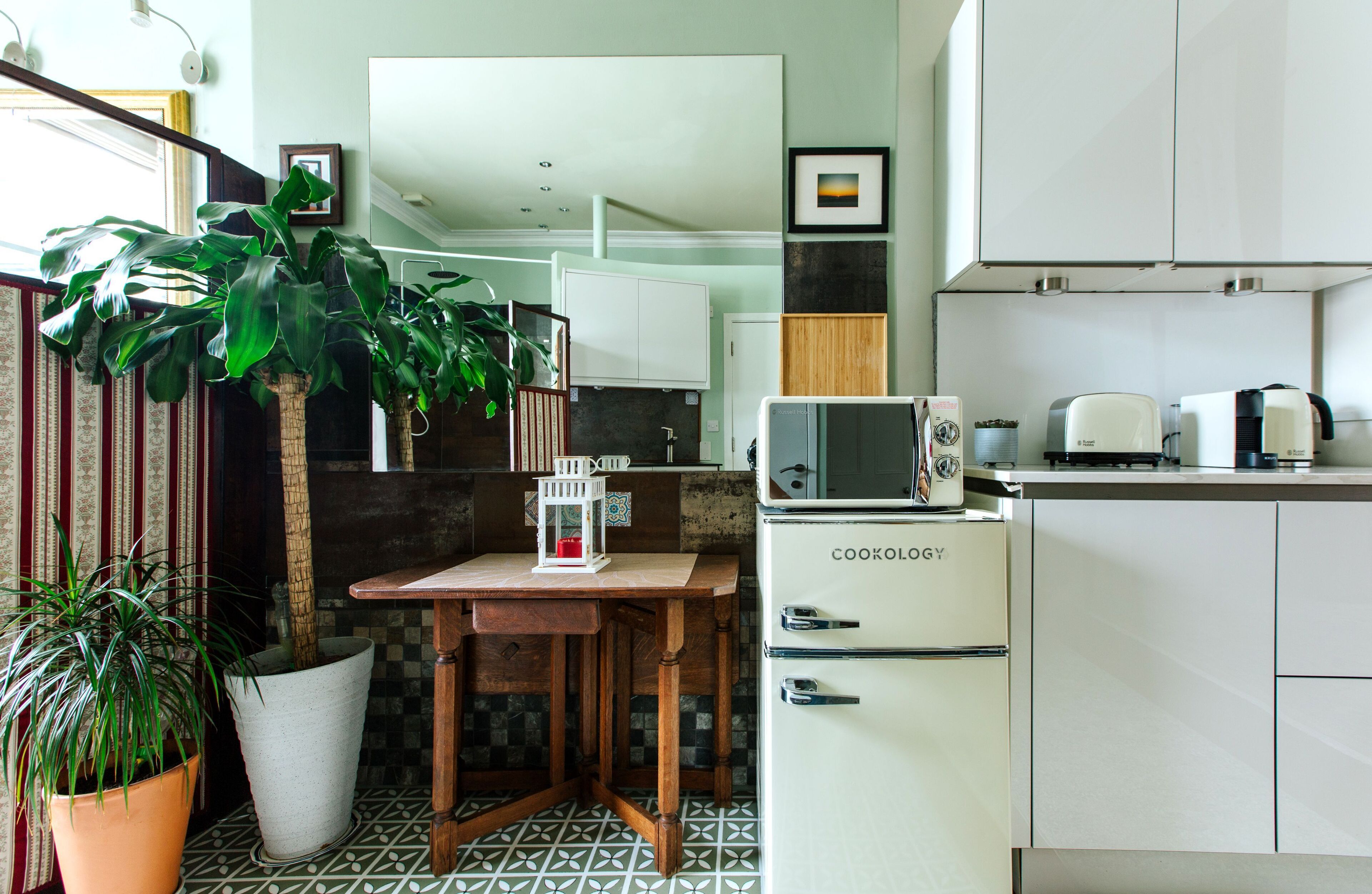 Fridge, microwave, coffee/tea maker, cookware/dishes/utensils