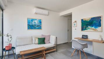 Apartment (Two Bedroom Apartment with Balcony) | Living room | 25-inch TV with satellite channels