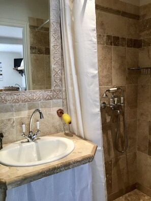 Shower, hair dryer, towels, soap