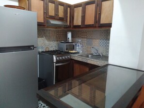 Microwave, coffee/tea maker, toaster, cookware/dishes/utensils
