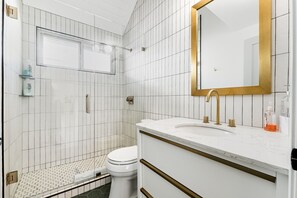 Shower, hair dryer, towels, soap