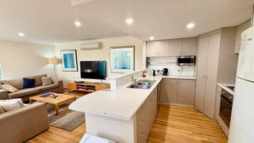 Microwave, oven, dishwasher, dining tables