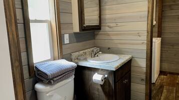 Shower, towels, soap, toilet paper