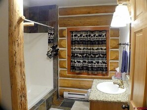 Combined shower/bathtub, hair dryer, towels, soap