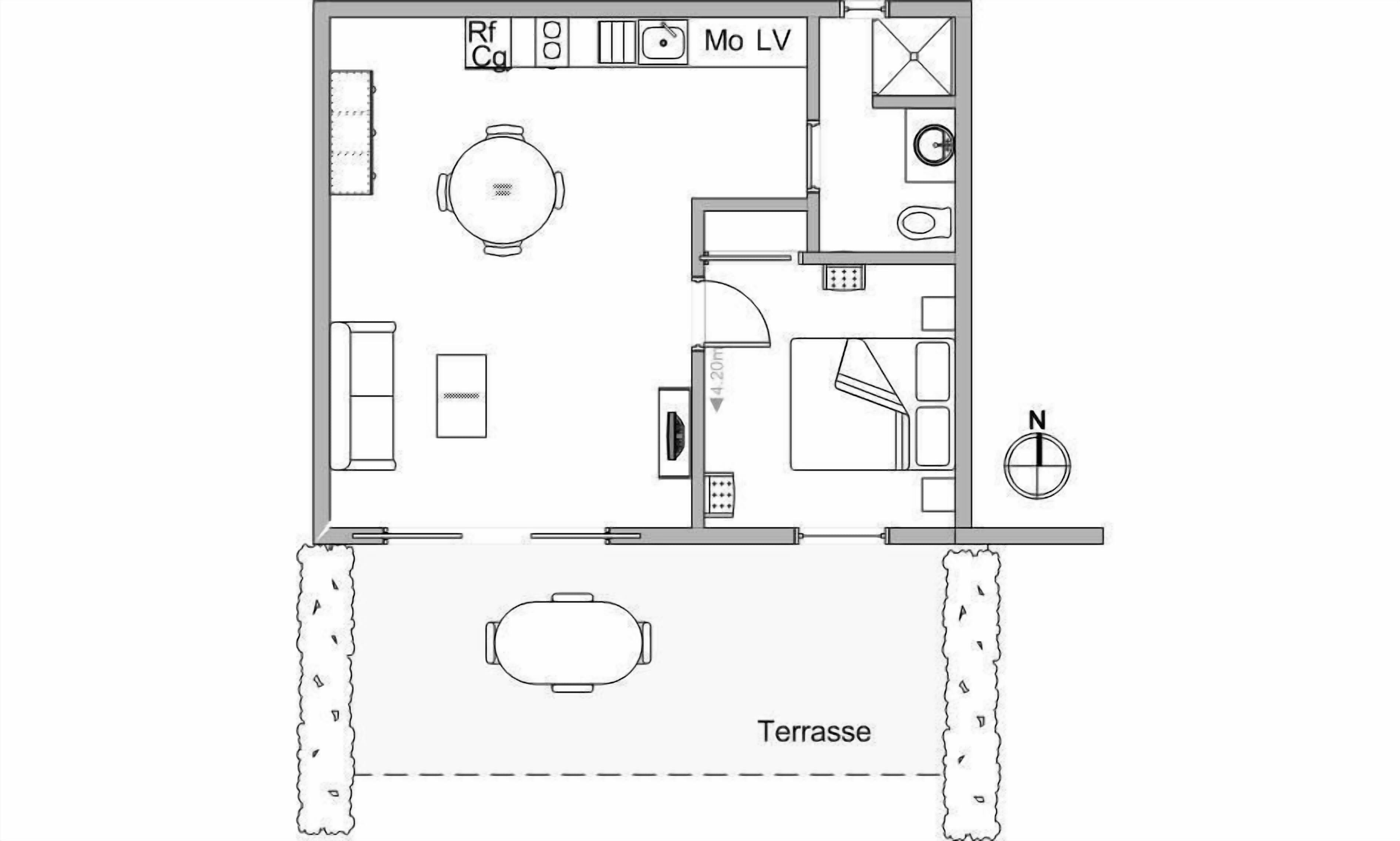 A floor plan of a hotel room with a bed, a desk, a chair, a small table, and a bathroom.