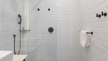 Shower, rainfall showerhead, hair dryer, towels
