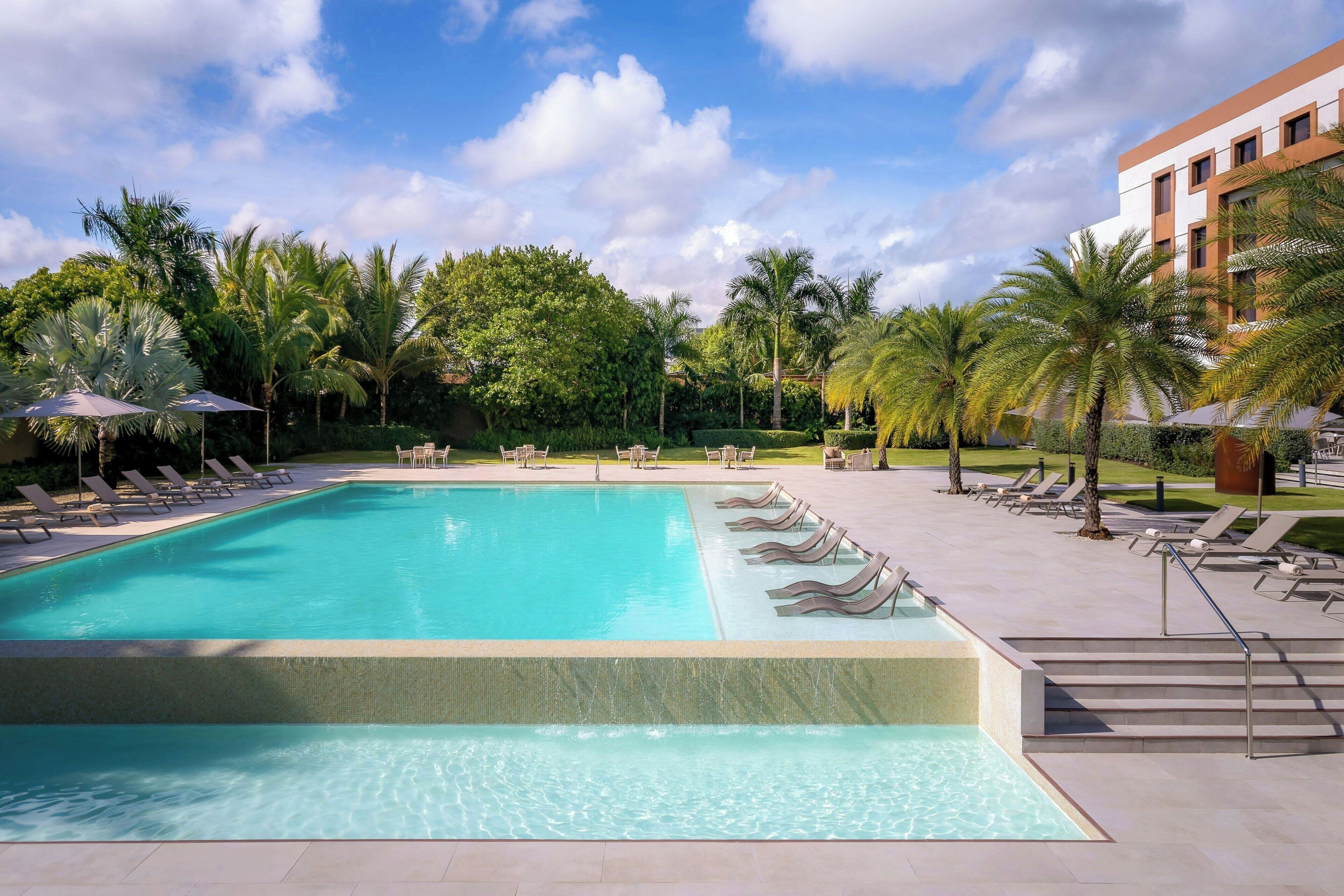 Outdoor pool, free pool cabanas, pool umbrellas