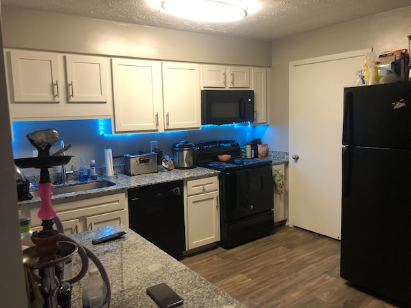 Microwave, dishwasher, cookware/dishes/utensils