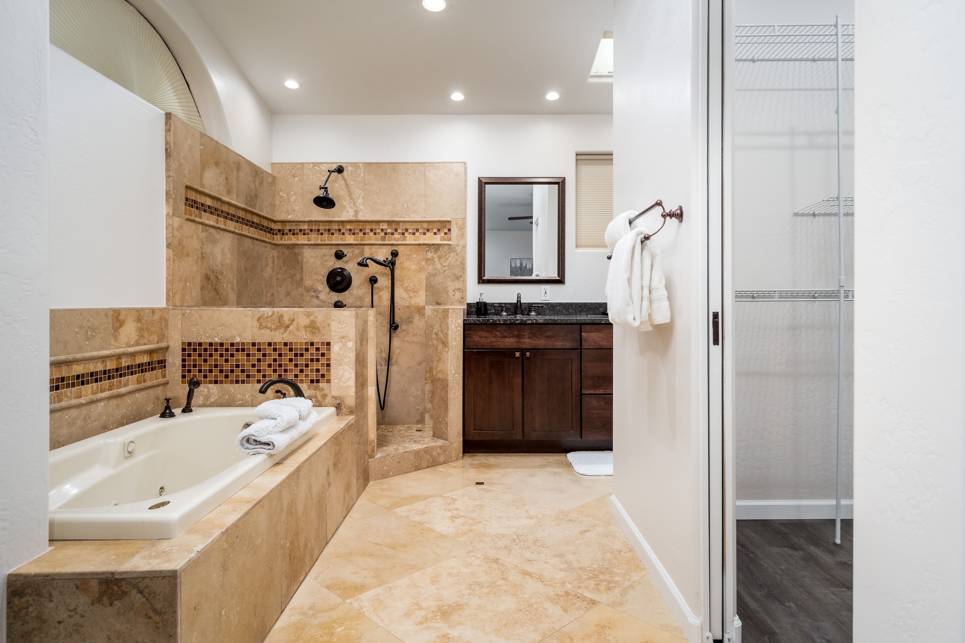 Combined shower/bathtub, hair dryer, towels, soap