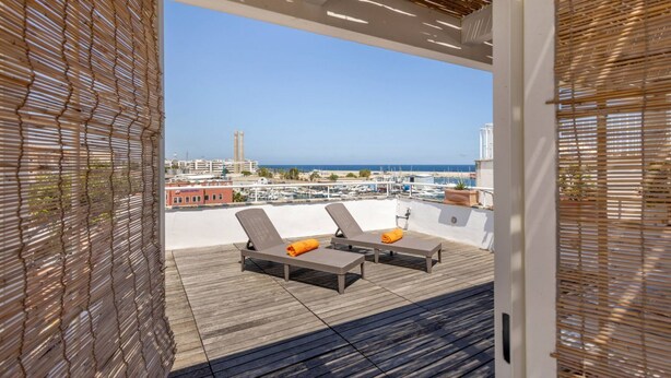 A wooden deck with two lounge chairs and a view of the ocean and marina. - WePuglia - Belvedere sul Porto (Monopoli)
