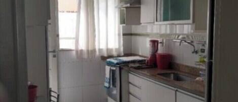 Fridge, stovetop, dishwasher, coffee/tea maker