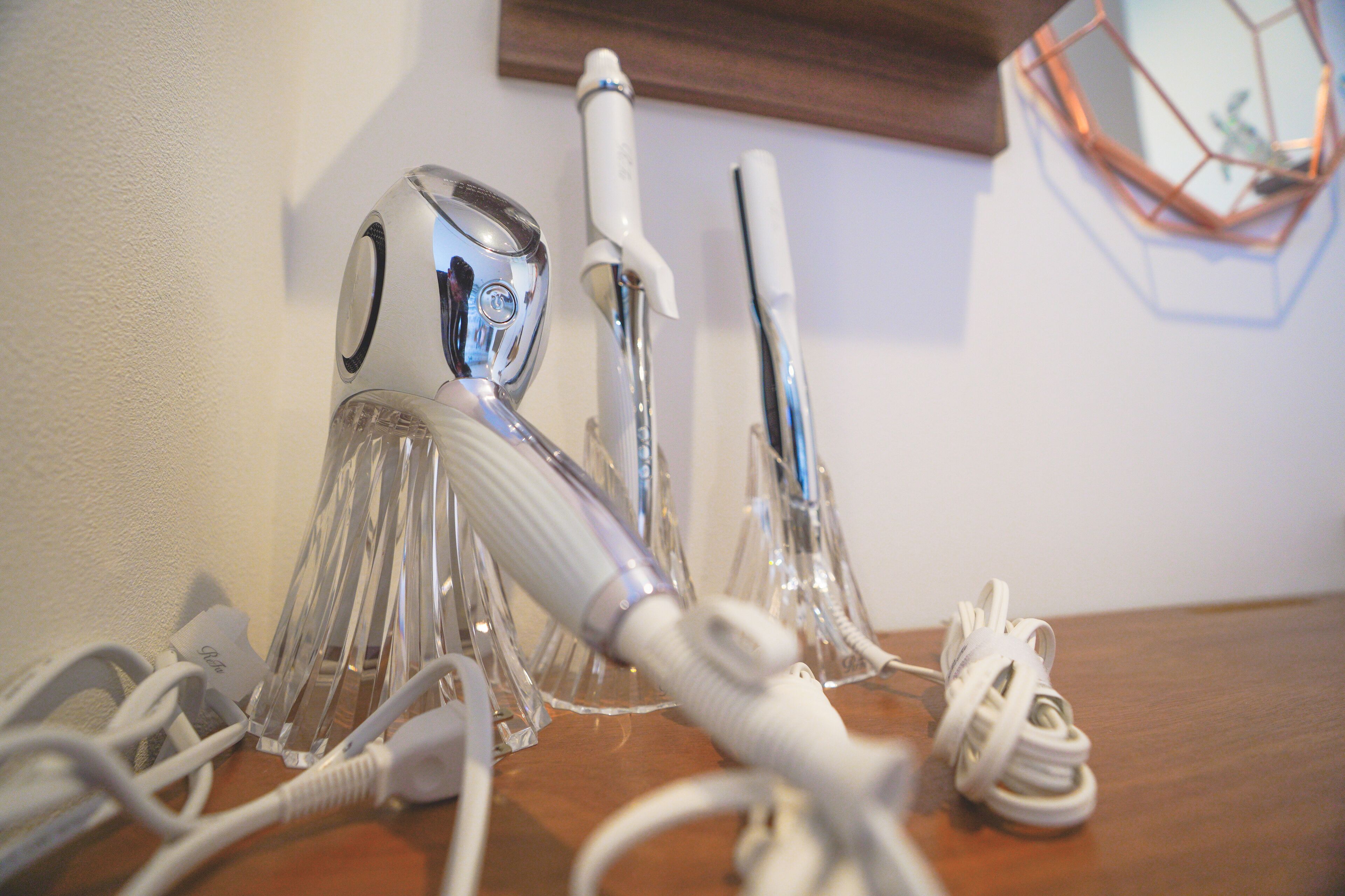 A table with various electronic devices and their cords.