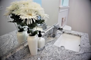 Combined shower/tub, hair dryer, towels, soap