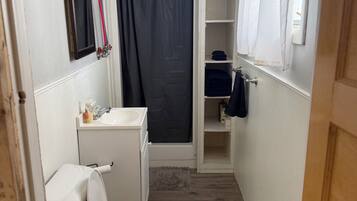 Shower, towels, soap, toilet paper