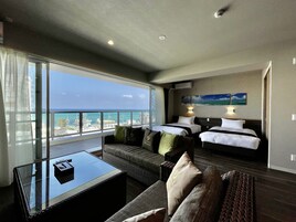 Deluxe Suite Condo with Partial Ocean View, Non Smoking | Down comforters, free WiFi, bed sheets