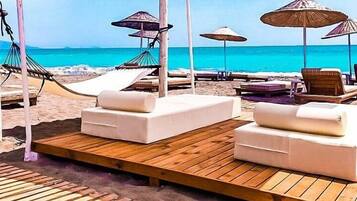 Private beach, free beach shuttle, free beach cabanas, sun-loungers