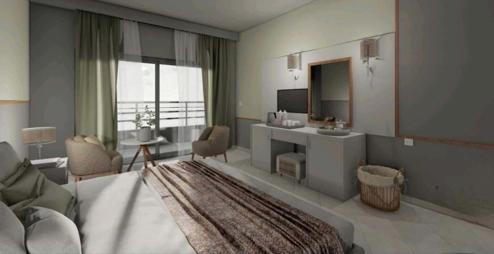 A modern hotel room with a bed, a sitting area with a chair and a small table, a vanity with a mirror, and a window with curtains.