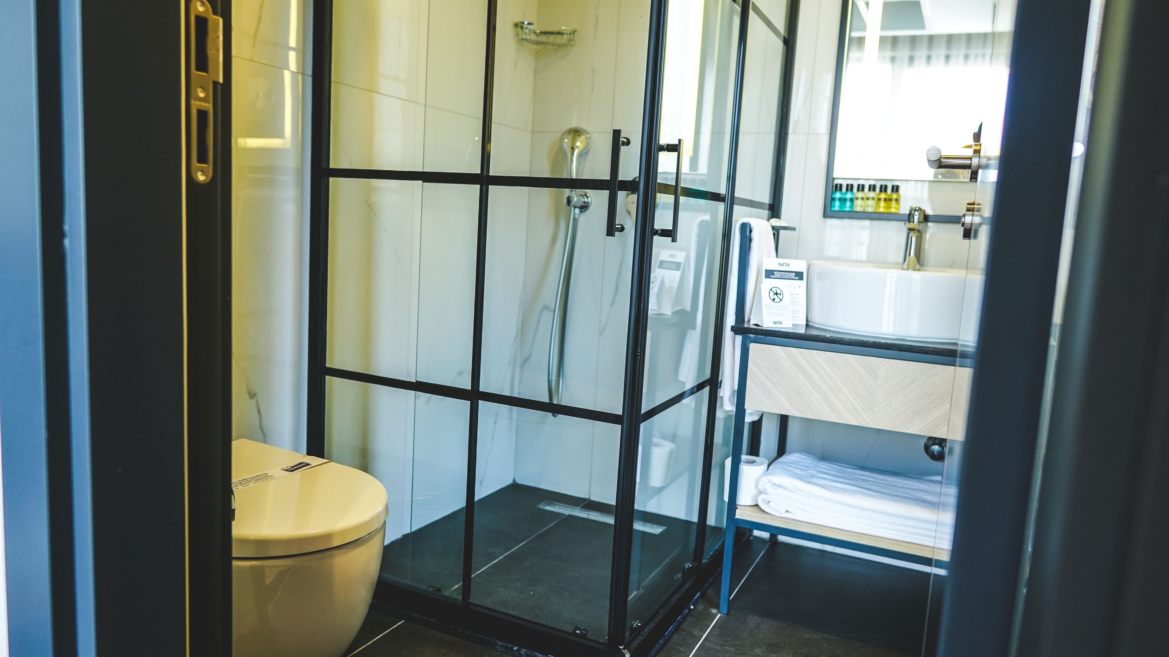 corner room | bathroom | shower, free toiletries, hair dryer, bathrobes