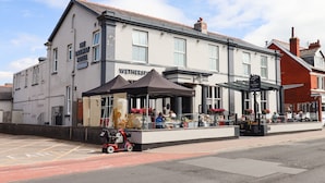 A building with a sign reading "The Railway Hotel" and "Wetherspoon" indicating a pub. - 3 Rothbury Place (Lytham St. Anne's)