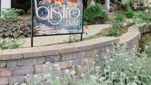 A building with a sign for 'Olde Bistro Inn' and a beer shot sign. - Top location, no cleaning fee, everthings close B (Lake Geneva)