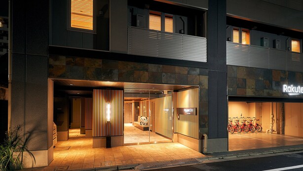 A hotel entrance with a modern design, a visible reception area, and a bike parking area. - Rakuten STAY Tokyo Asakusa (Tokyo)