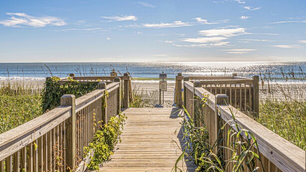 A wooden boardwalk leading to a beach with a clear sky and ocean view. - Three Bedroom Resort Condo close to Golf, Beach, Shopping & Popular Attractions (Myrtle Beach)