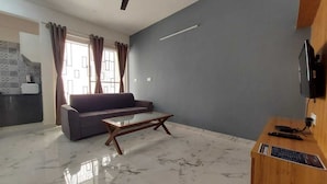 Apartamento Deluxe | Zona de estar